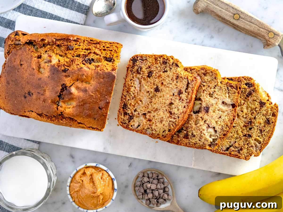Moist Banana Bread Recipe with Whole Grain and Yogurt 3 healthy banana bread sliced on a marble cutting board