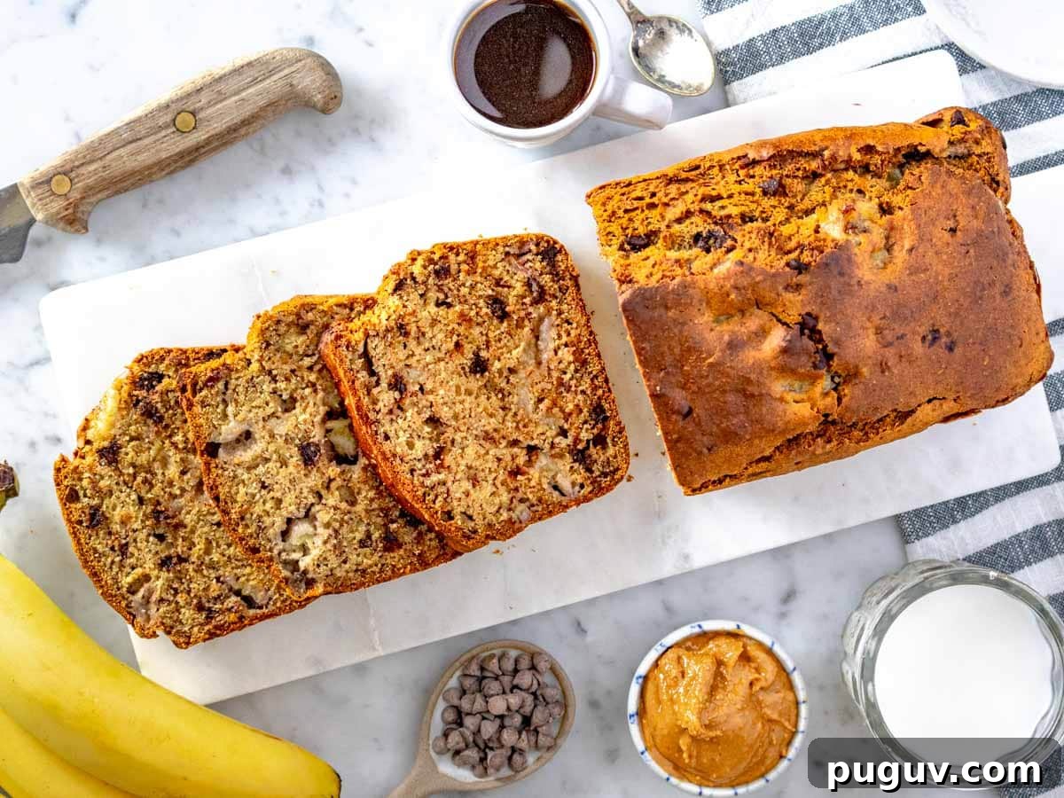 Moist Banana Bread Recipe with Whole Grain and Yogurt 9 slices and loaf of healthy banana bread served with coffee and peanut butter