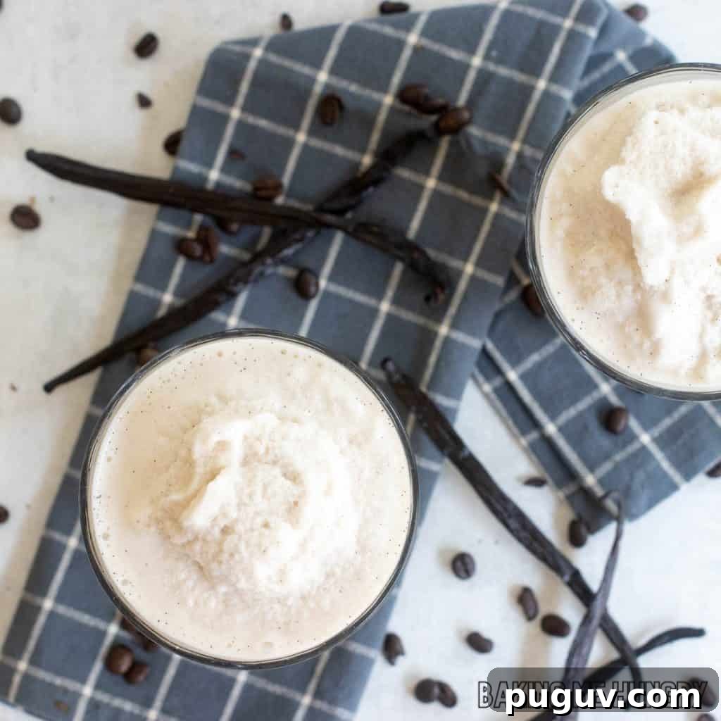 Copycat Vanilla Coffee Frappuccino Recipe for Cafe-Style Blended Drink 3 vanilla coffee frappuccino recipe in two glasses from overhead close up