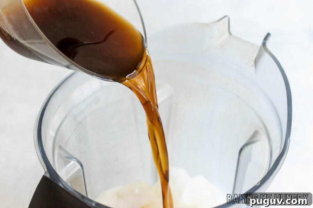 Copycat Vanilla Coffee Frappuccino Recipe for Cafe-Style Blended Drink 5 espresso being added