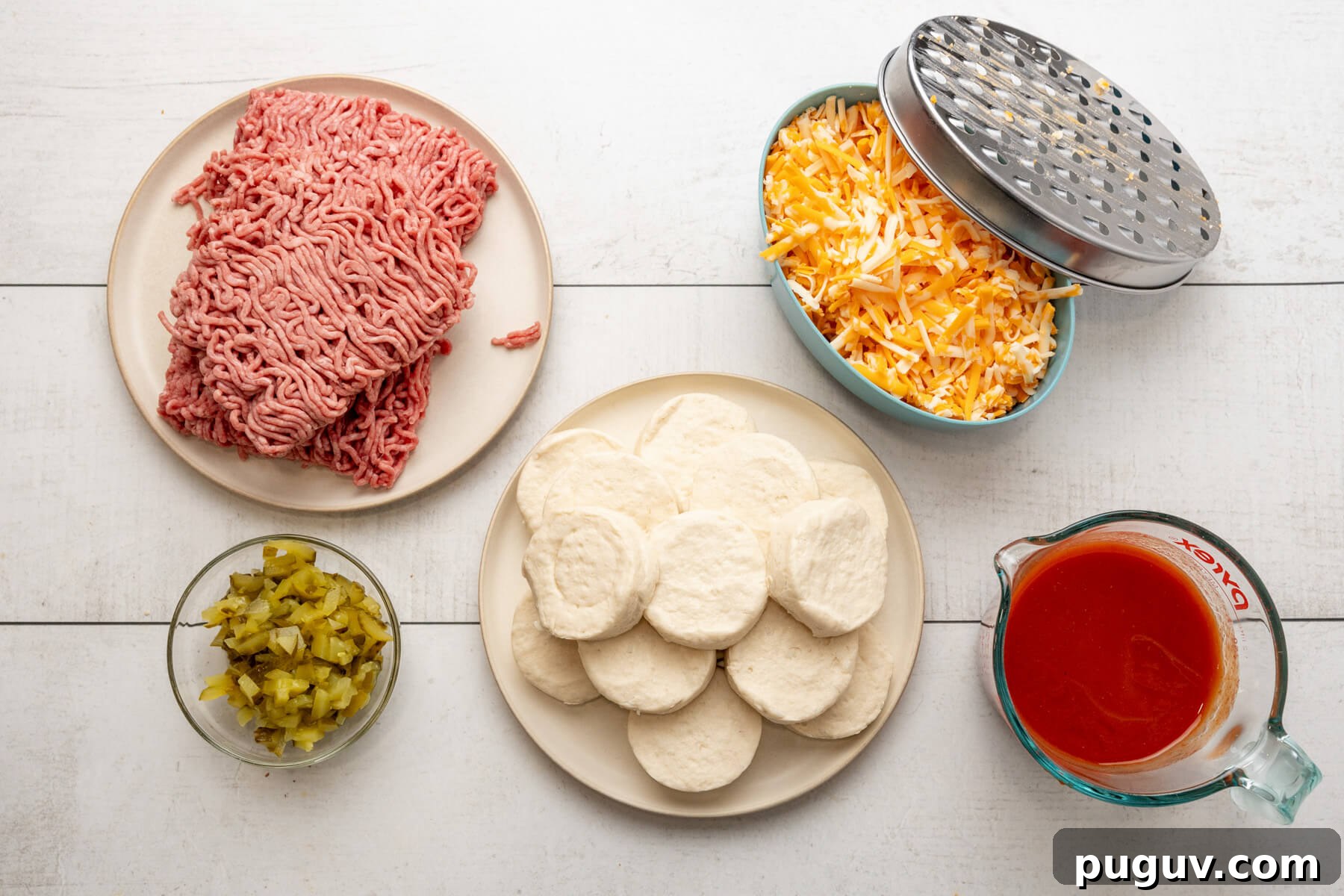 Hamburger, canned biscuits, chopped pickles, shredded cheese, and sloppy joe sauce.
