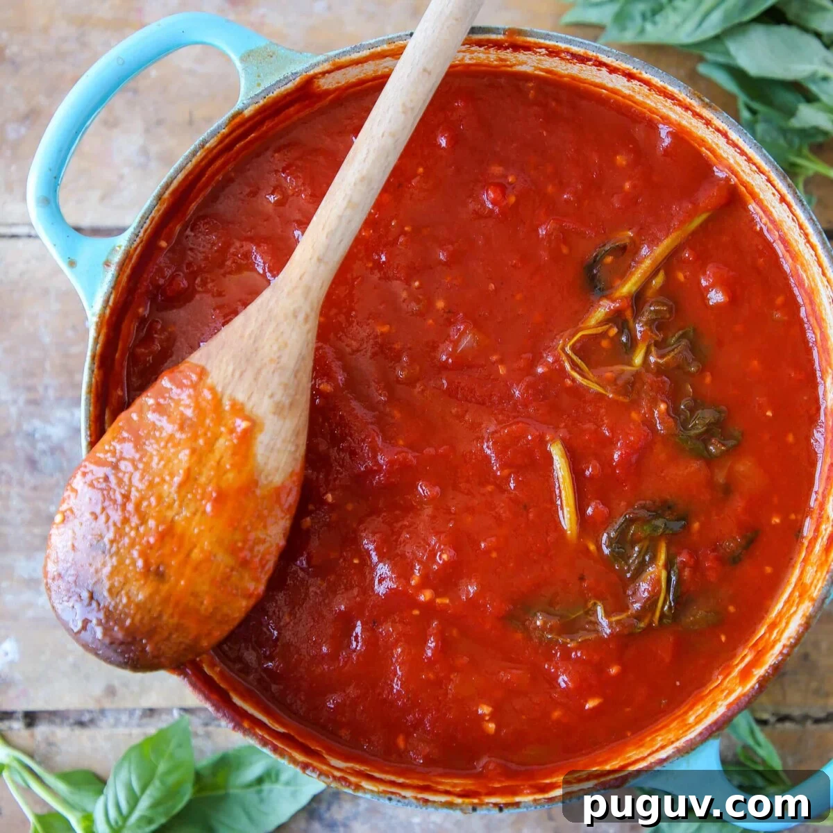 Homemade Tomato Pasta Sauce in blue dutch oven.
