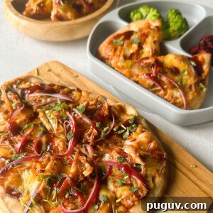 BBQ Chicken Naan Pizza Recipe: Crispy Naan, Tangy Sauce 12 BBQ chicken naan pizzas served with broccoli and cherries.