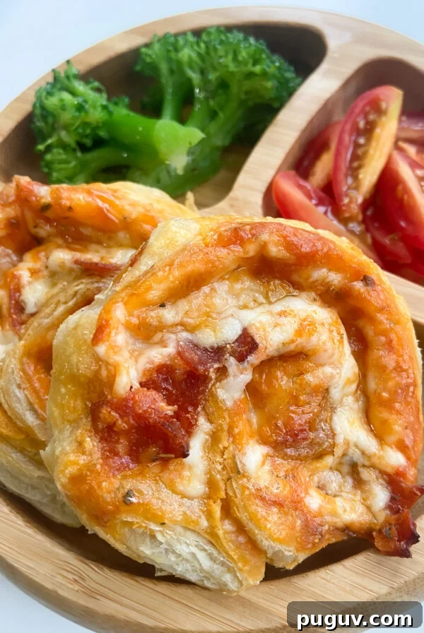 BBQ Chicken Naan Pizza Recipe: Crispy Naan, Tangy Sauce 10 Pizza pinwheels served with broccoli and tomatoes