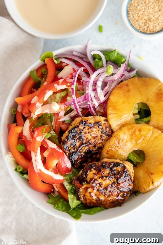 burger bowl overhead shot of a healthy deconstructed Hawaiian chicken burger bowl drizzled with teriyaki mayo burger sauce