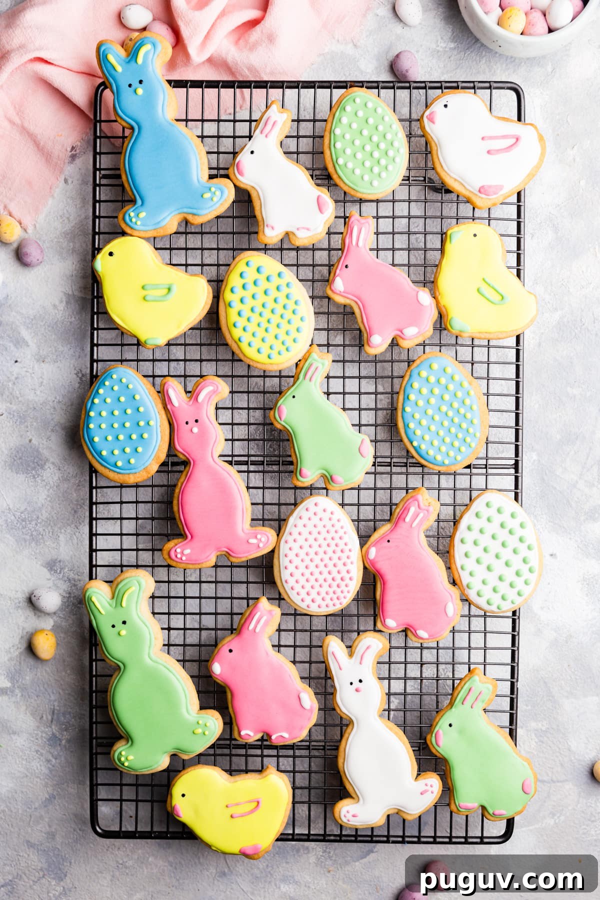 Easter Sugar Cookie Recipe with Simple Decorative Icing 8 top view of Easter sugar cookies with royal icing on a wire rack
