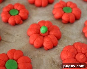 Festive Christmas Spritz Cookie Recipes for the Holidays 4 christmas-poinsettia-spritz
