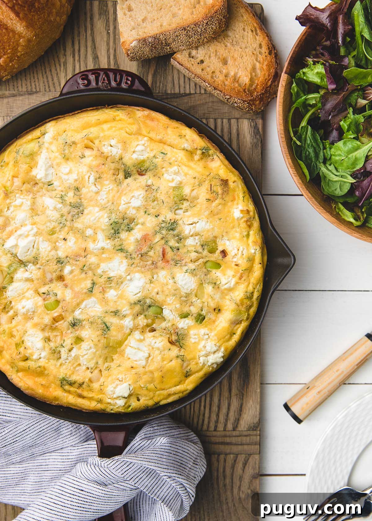 Smoked Salmon, Leek & Goat Cheese Frittata Recipe 9 overhead of goat cheese and salmon frittata with slices of toast and a salad