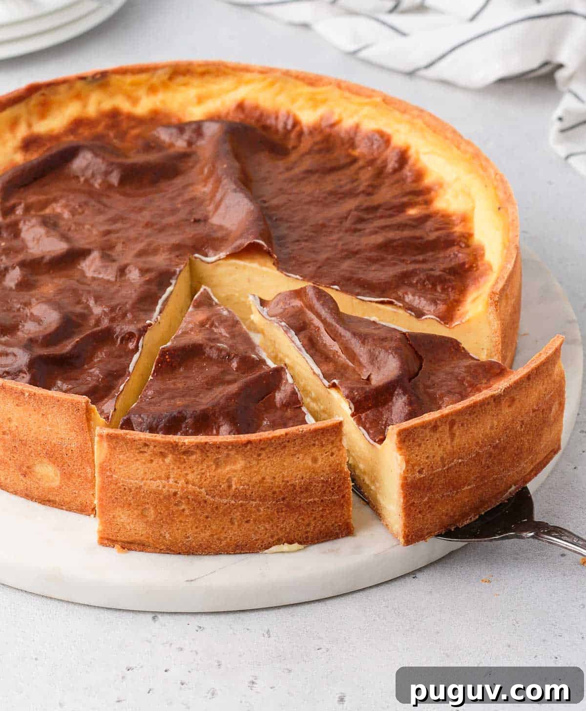 Two slices of tart being cut off.