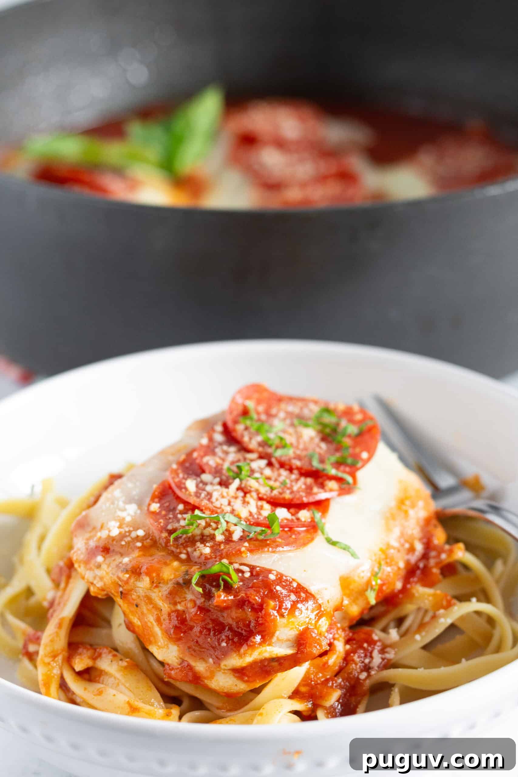 Pepperoni Pizza Chicken Skillet: One-Pan Family Dinner 3 Pepperoni Pizza Chicken Skillet on a white plate.