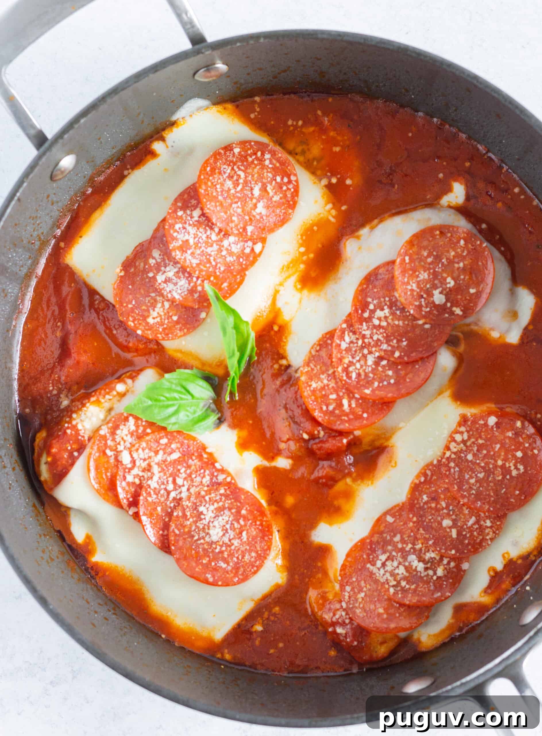 Pepperoni Pizza Chicken Skillet: One-Pan Family Dinner 5 Looking down at a skillet of pepperoni pizza chicken.