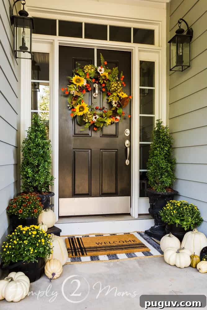 13 Stunning Ways to Add Fall Color to Your Home 10 front door with sunflower wreath and pumpkins