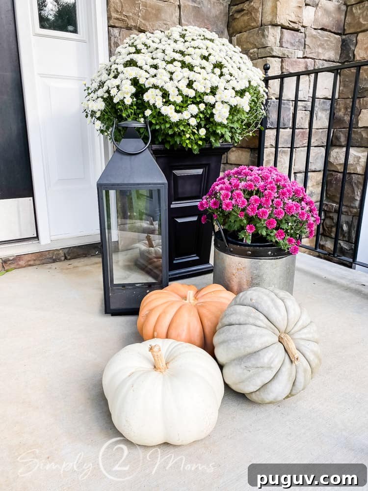 13 Stunning Ways to Add Fall Color to Your Home 11 front porch with mums and pumpkins