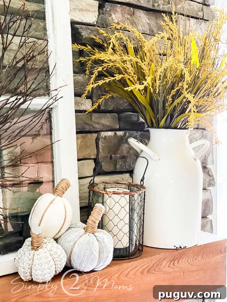 13 Stunning Ways to Add Fall Color to Your Home 12 fireplace mantel with enamel jug and fall grasses