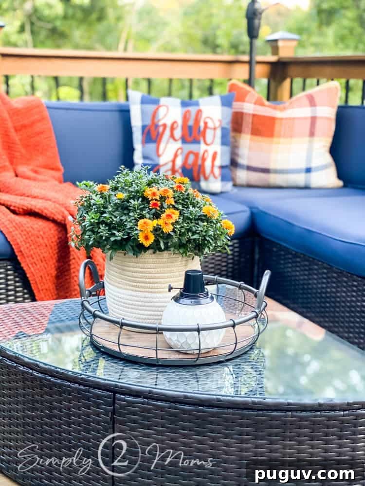 13 Stunning Ways to Add Fall Color to Your Home 3 Outdoor sectional with throw blanket and plaid pillows