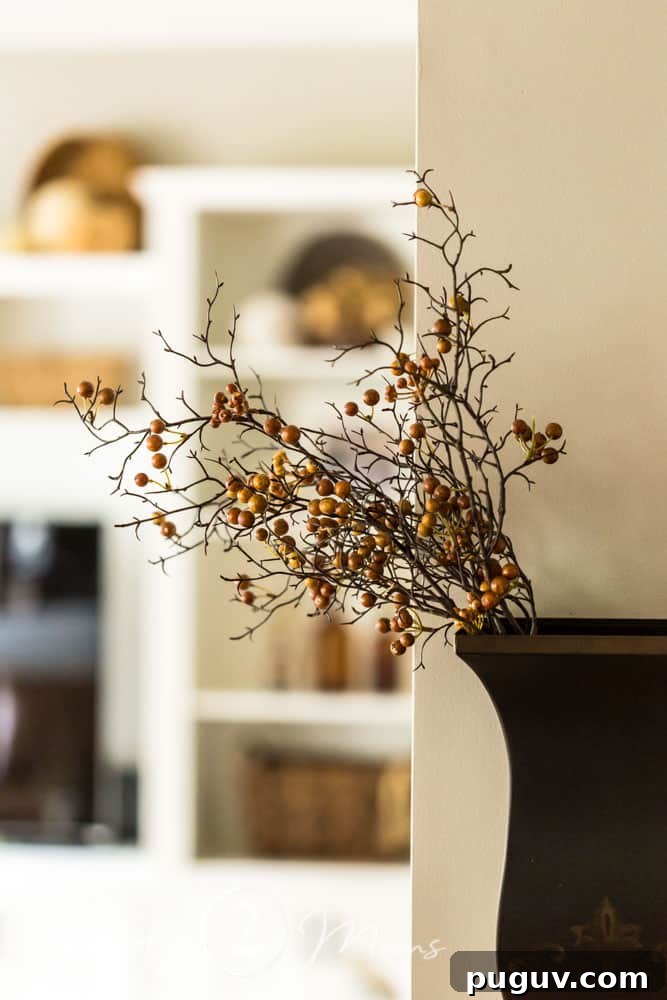 13 Stunning Ways to Add Fall Color to Your Home 15 wall sconce holding fall berries