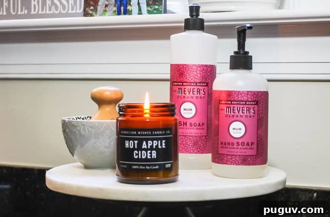 13 Stunning Ways to Add Fall Color to Your Home 17 cake stand with hand soap and amber jar candle