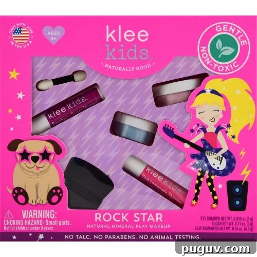Clean Makeup for Tweens: 8 Safe Brands for Kids and Teens 2 The photograph displays a bright pink box of Klee Kids "Rock Star" Natural Mineral Play Makeup for children, featuring various cosmetic items and animated graphics of a rock star and a dog in sunglasses.
