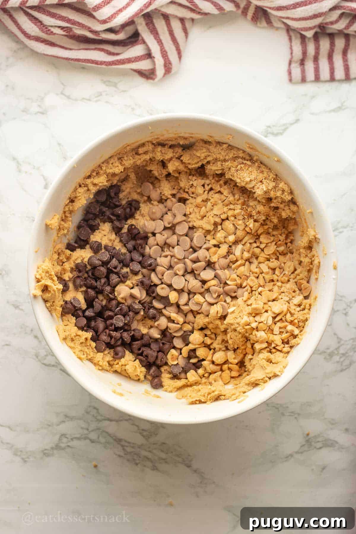 Baking chips in bowl of cookie dough.