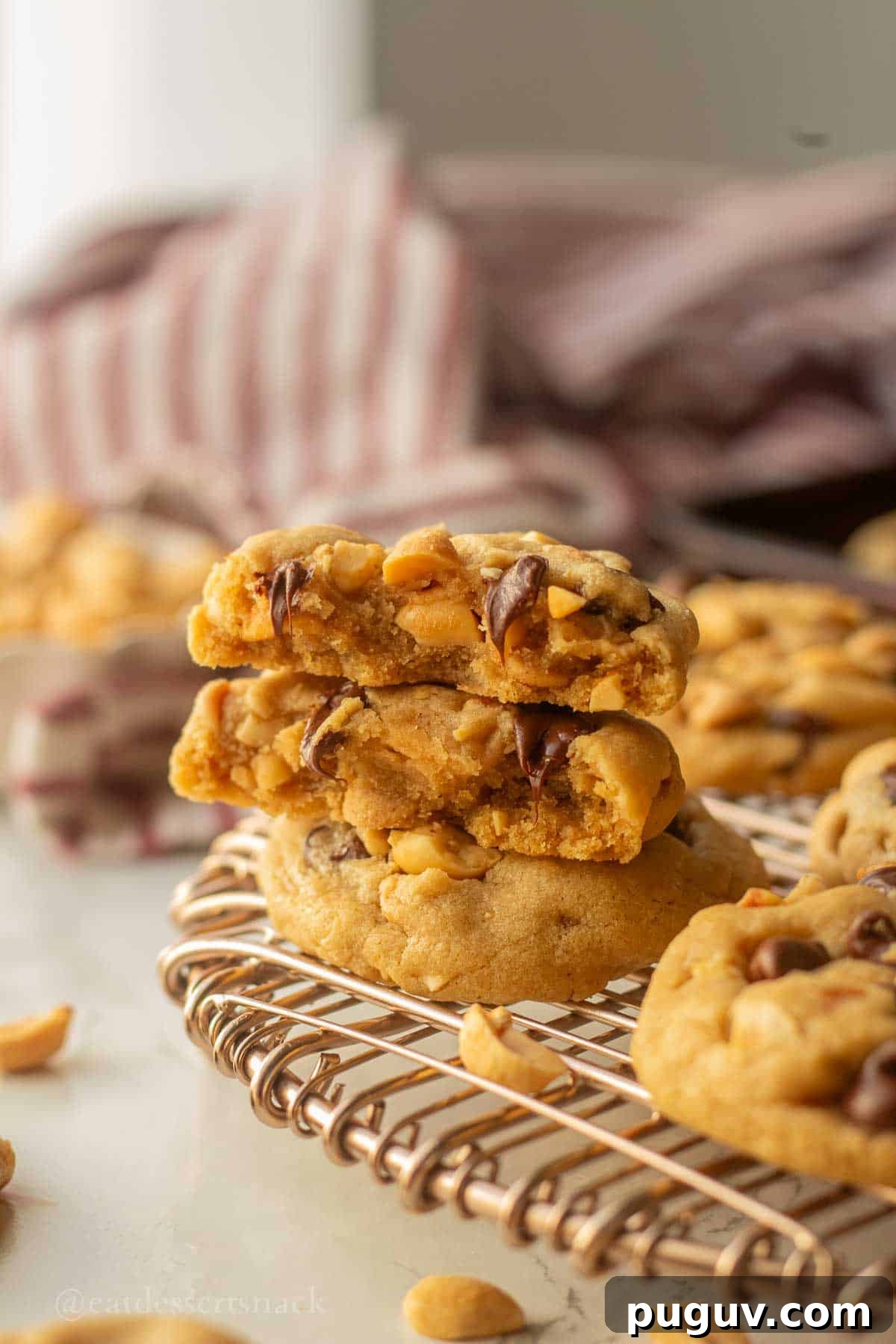Stacked baked peanut butter cookies.