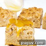 Apple crumb cake being drizzled in caramel sauce