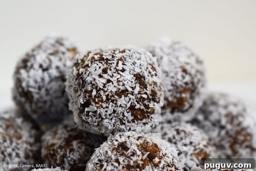 Maple Almond Energy Bites Recipe for Quick Natural Snacks 4 Coconut covered bliss balls on a plate.