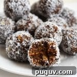 Maple Almond Energy Bites Recipe for Quick Natural Snacks 6 Maple almond bliss balls on a plate.