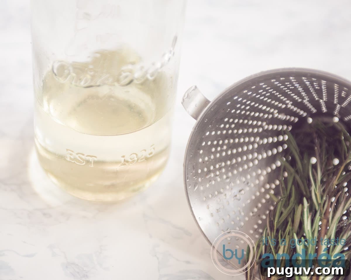 rosemary sugar water and a sieve with rosemary