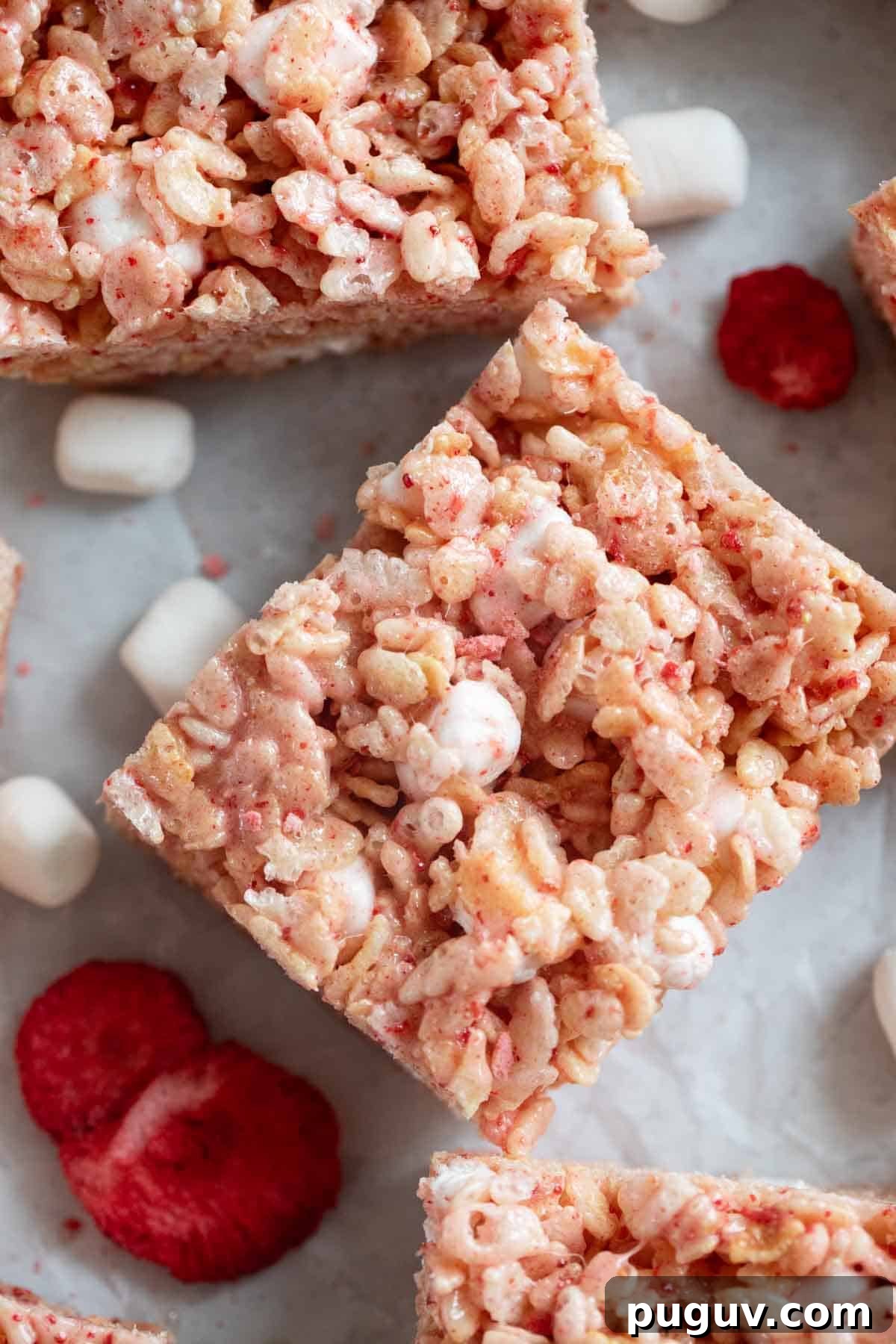 Strawberry Rice Krispie Treats Recipe — Quick No-Bake Dessert 9 Strawberry Rice Krispie Treats with freeze dried strawberries.