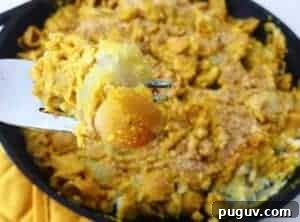 Classic Baked Potato Mac and Cheese Casserole 2 Baked potato macaroni and cheese in a cast iron skillet.