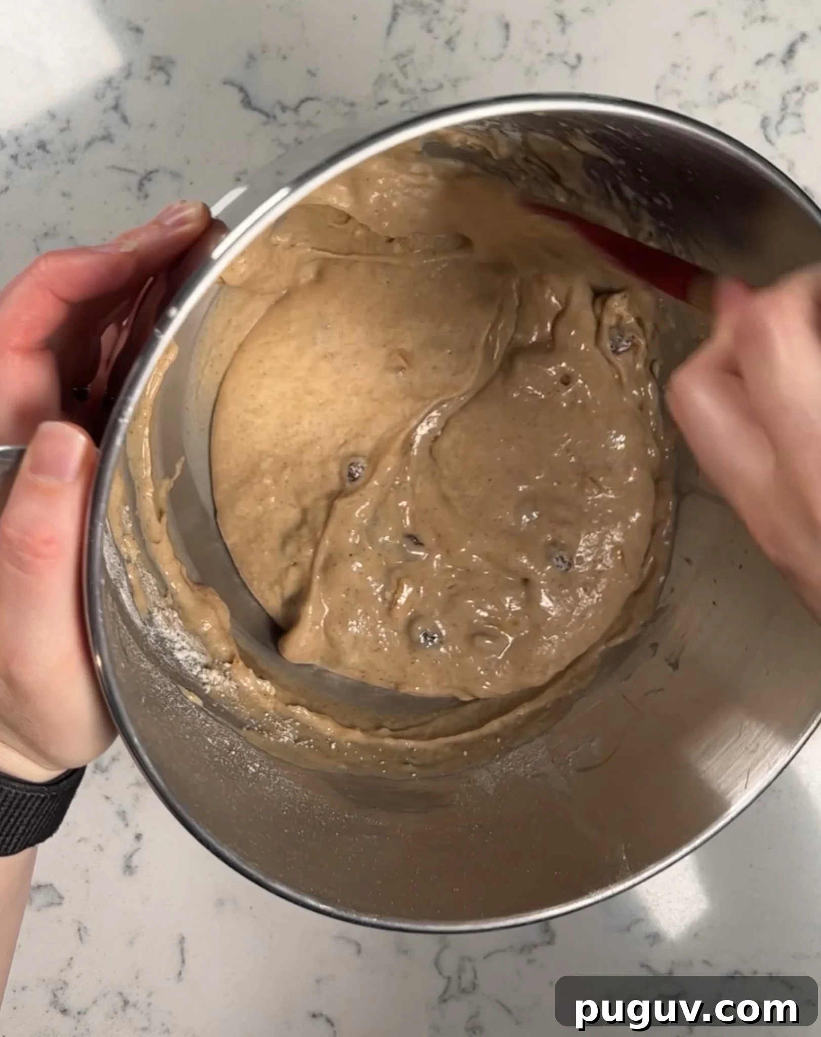 Folding together the batter.