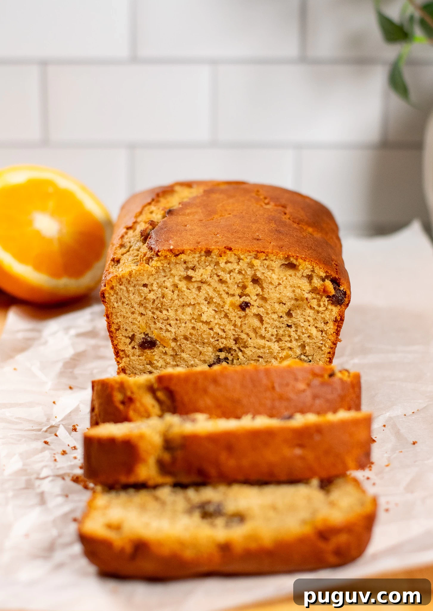 A christmas loaf cake with raisins and orange peel.