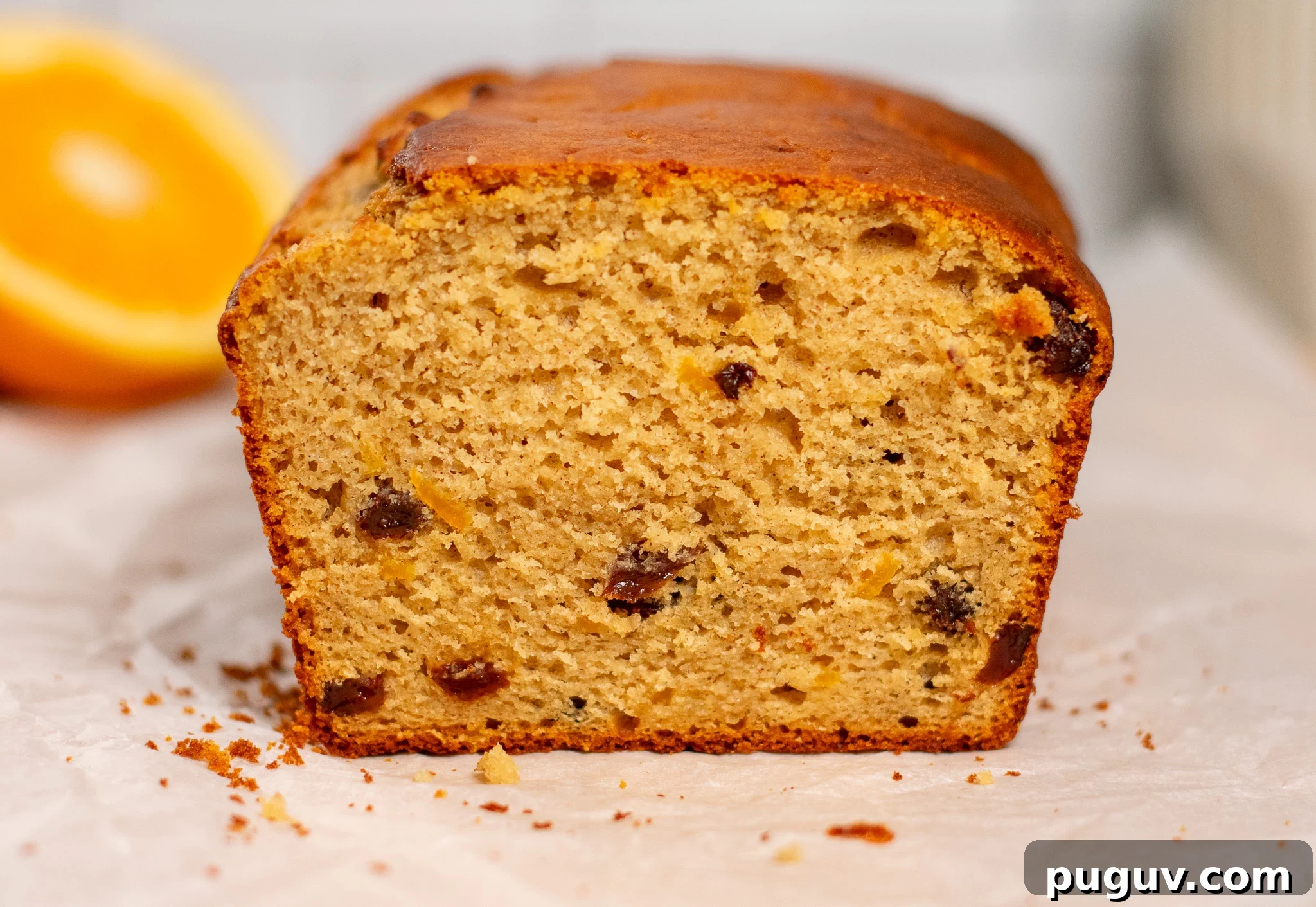 A christmas loaf cake with raisins and orange peel.