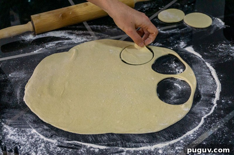 Mushroom Khinkali: Georgian Vegetarian Dumpling Recipe 5 Cutting out circles of your dough