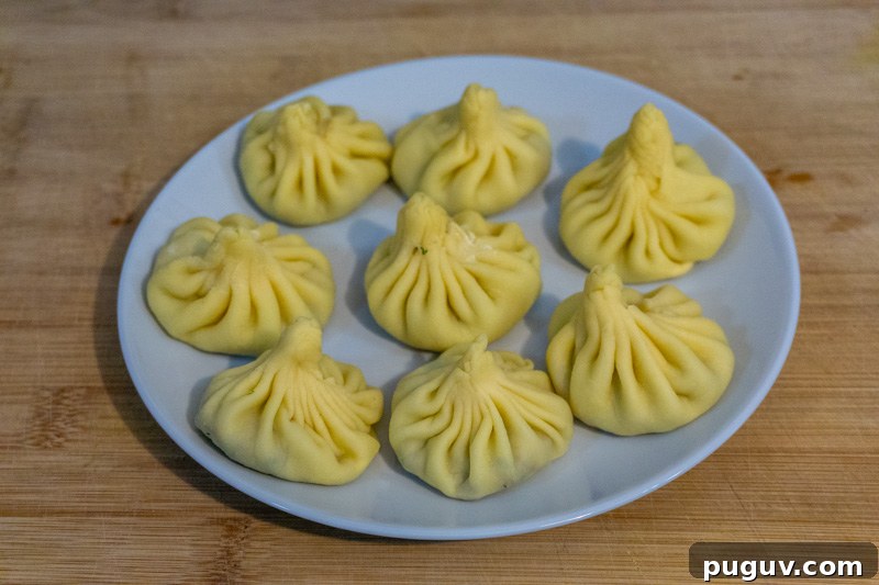 Mushroom Khinkali: Georgian Vegetarian Dumpling Recipe 7 Raw khinkali ready to be boiled