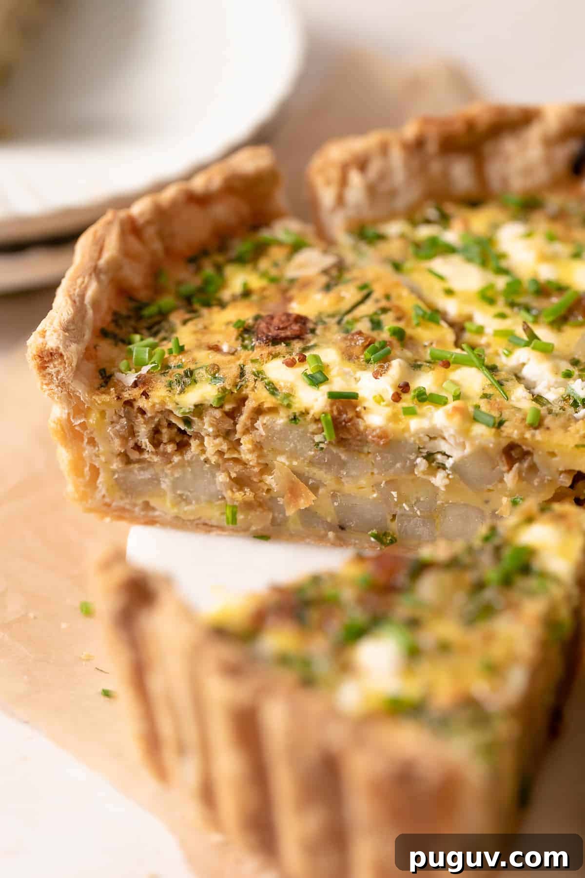 puff pastry quiche cut into slices.