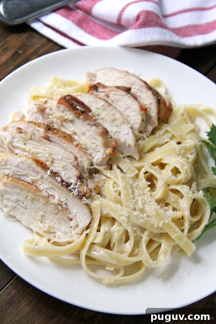 Grilled Chicken Alfredo Pasta with homemade alfredo sauce on plate