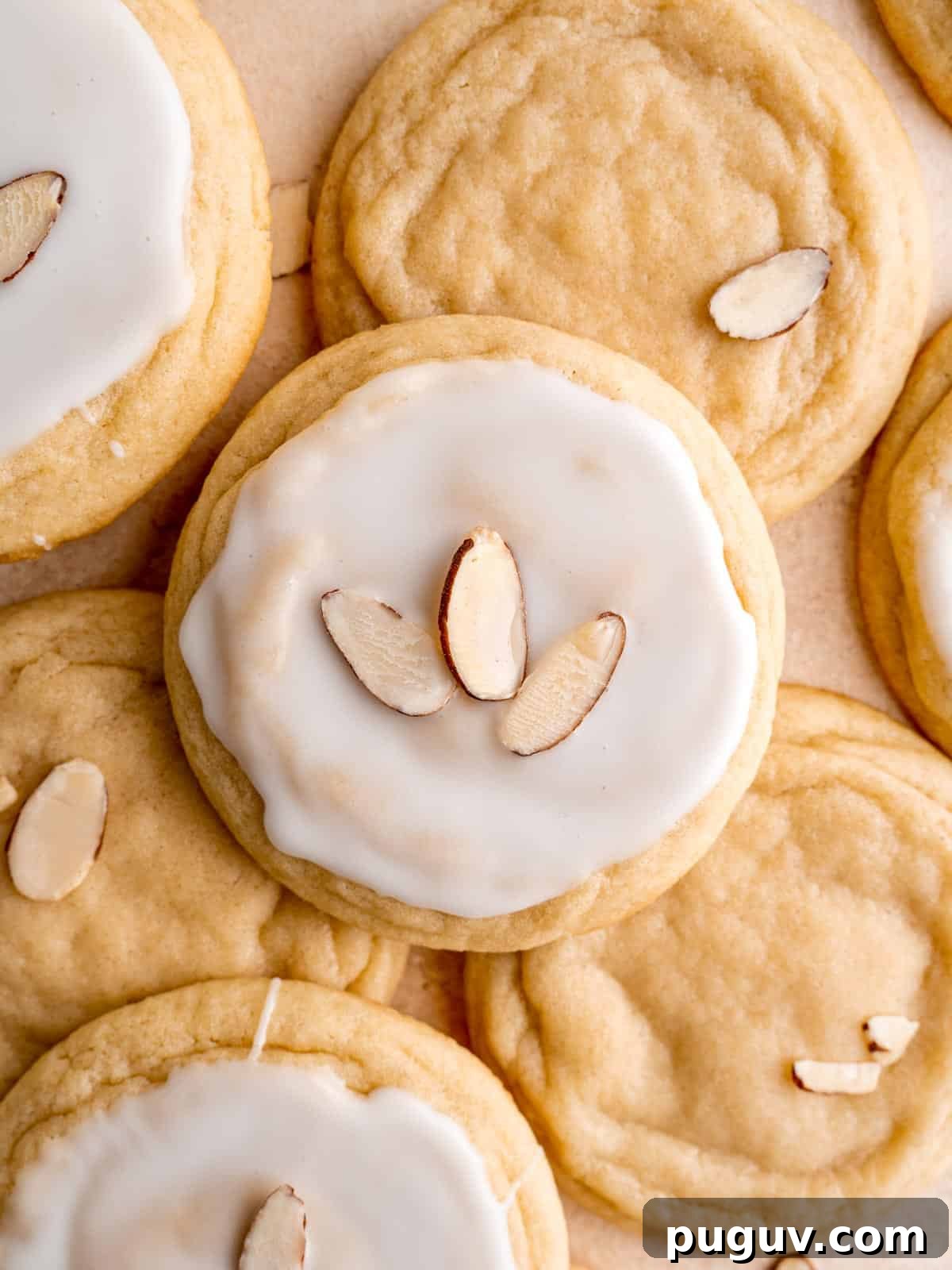 Soft Almond Sugar Cookies with Melt-In-Your-Mouth Texture 2 Soft almond sugar cookies with icing.