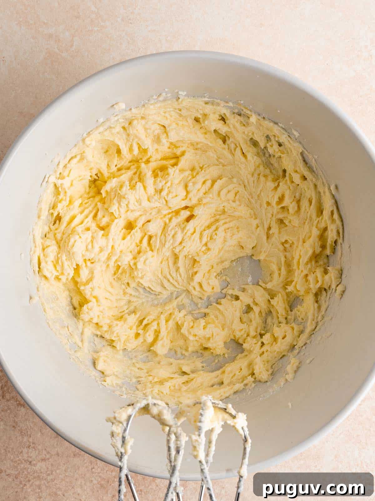 Soft Almond Sugar Cookies with Melt-In-Your-Mouth Texture 5 Wet cookie ingredients mixed together in a bowl.