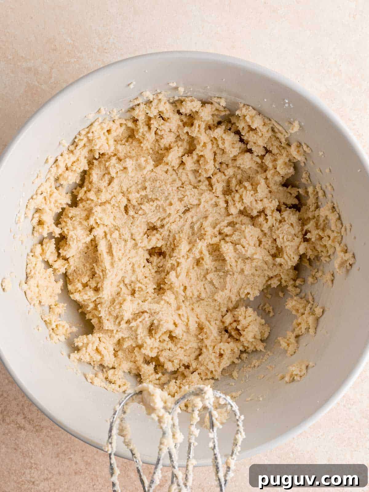 Soft Almond Sugar Cookies with Melt-In-Your-Mouth Texture 6 Almond flavored cookie dough in a bowl.