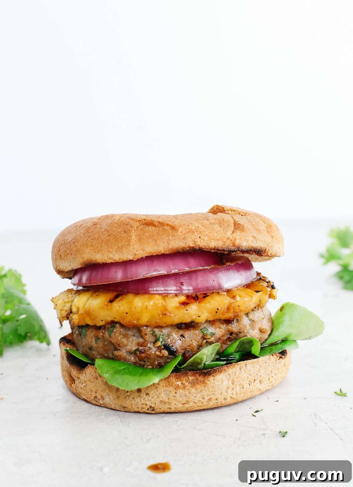 These delicious Hawaiian Turkey Burgers are packed with tons of flavor, made with a healthy homemade teriyaki sauce and topped with fresh grilled pineapple!