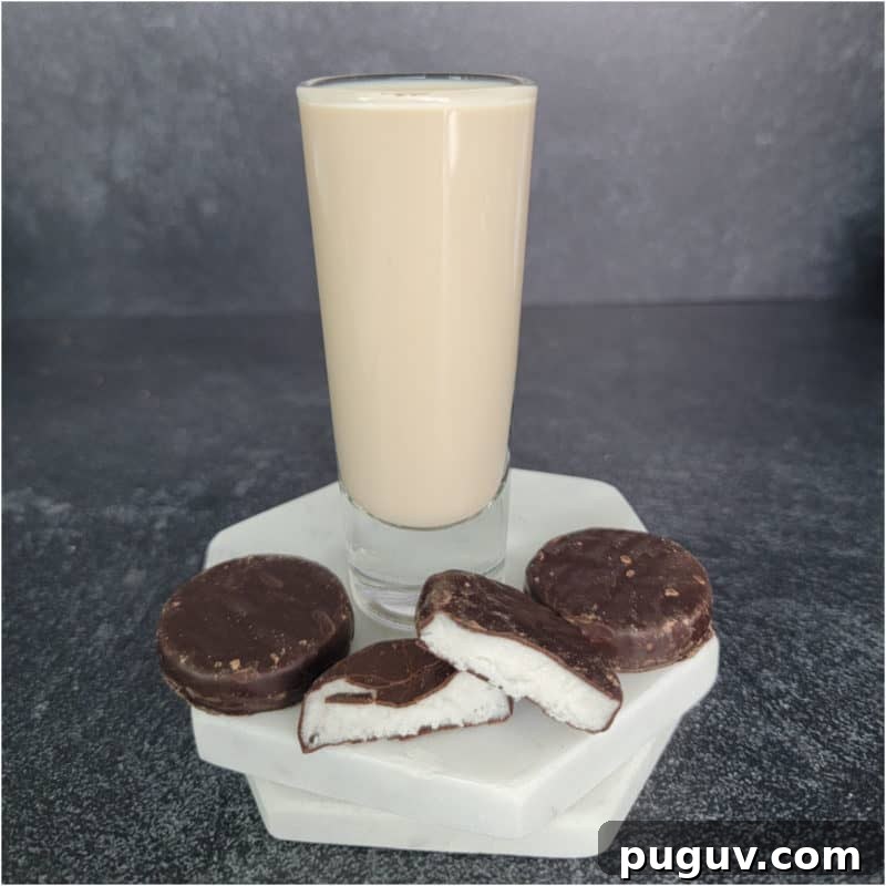 Christmas Cocktail Recipes Everyone Will Love 27 peppermint patty chocolate next to a shot glass filled with peppermint patty shot