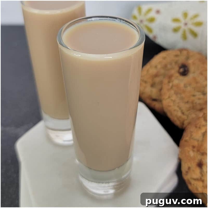 Christmas Cocktail Recipes Everyone Will Love 32 Oatmeal Cookie Shots next to oatmeal cookies and a flower napkin