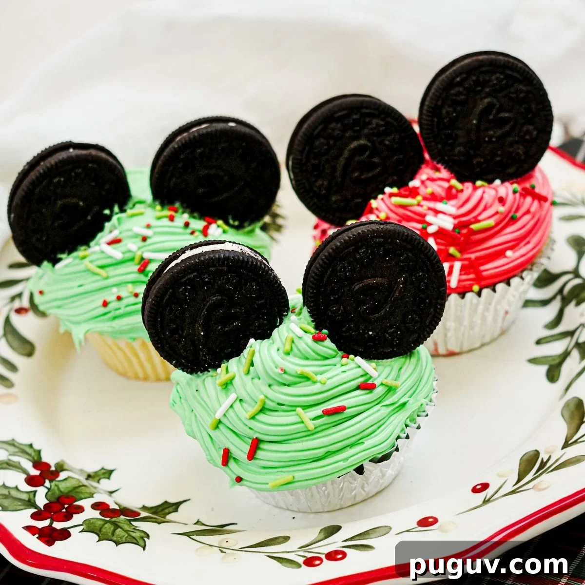 Mickey Mouse Ear Christmas Cupcakes on a Christmas plate.