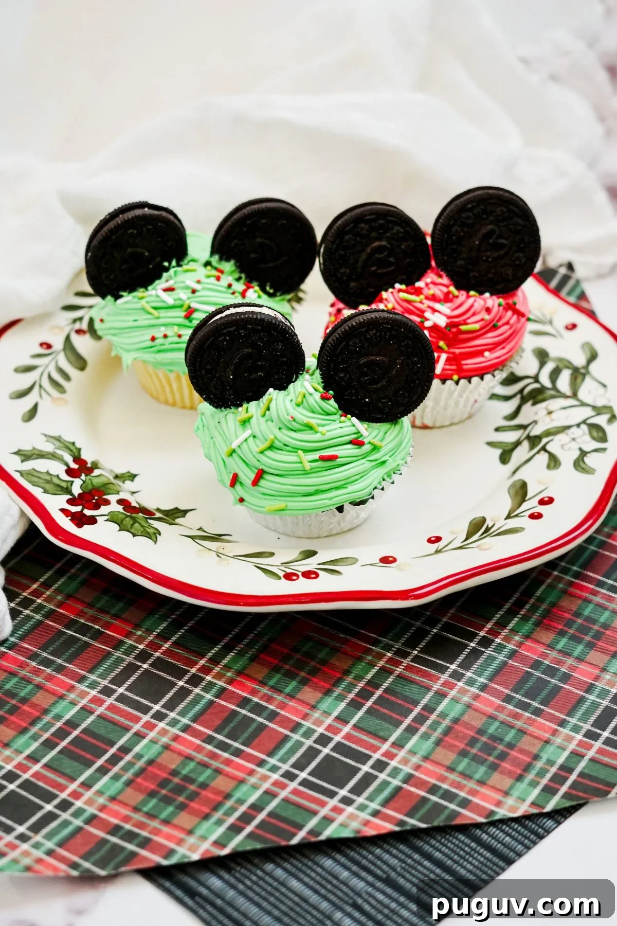 Plate with Green and Red Mickey Mouse Cupcakes for Christmas.