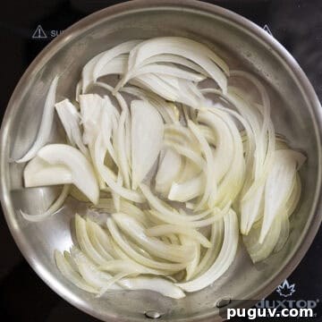Fig Jam & Goat Cheese Burger Recipe for Sweet Savory Flavor 4 Onions frying in the frying pan.