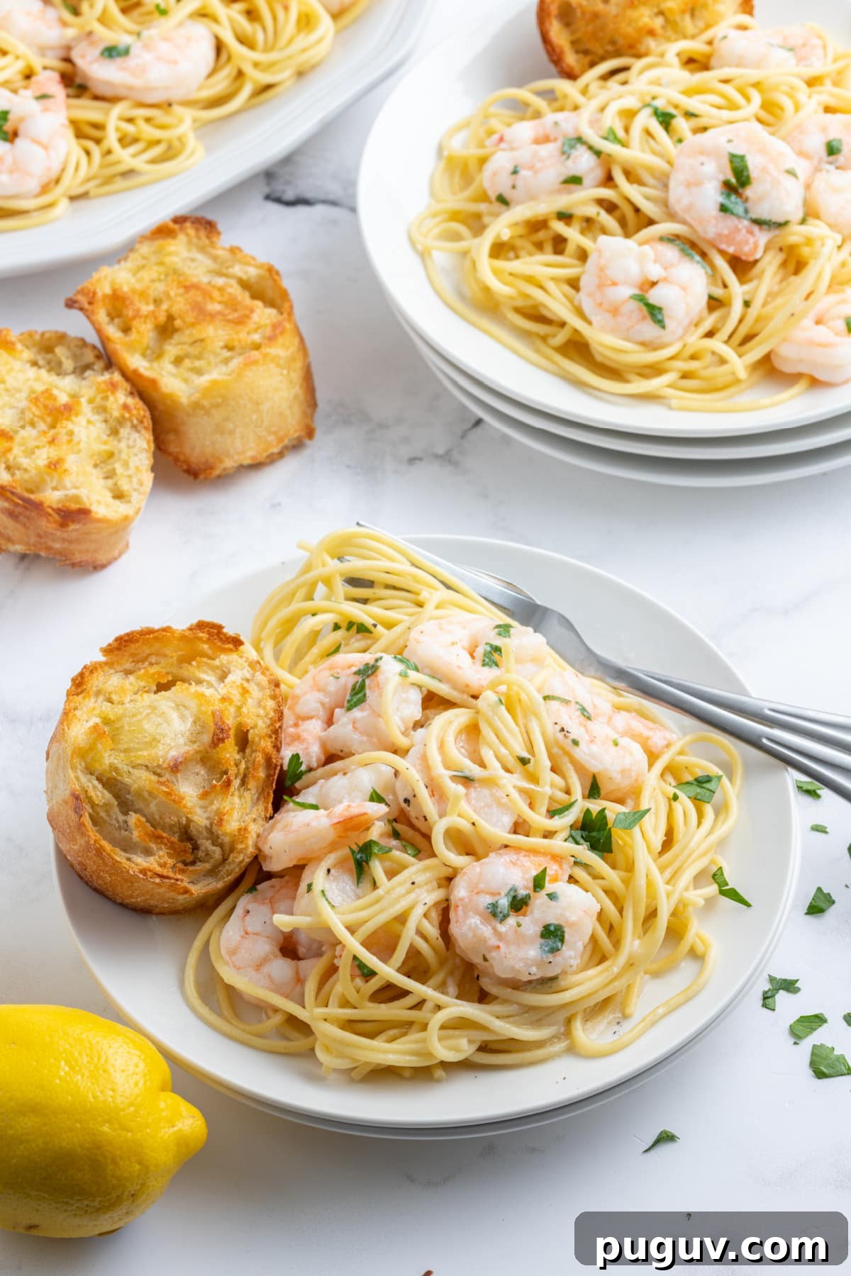 Shrimp Scampi plated shrimp scampi serving on plate with pasta and bread