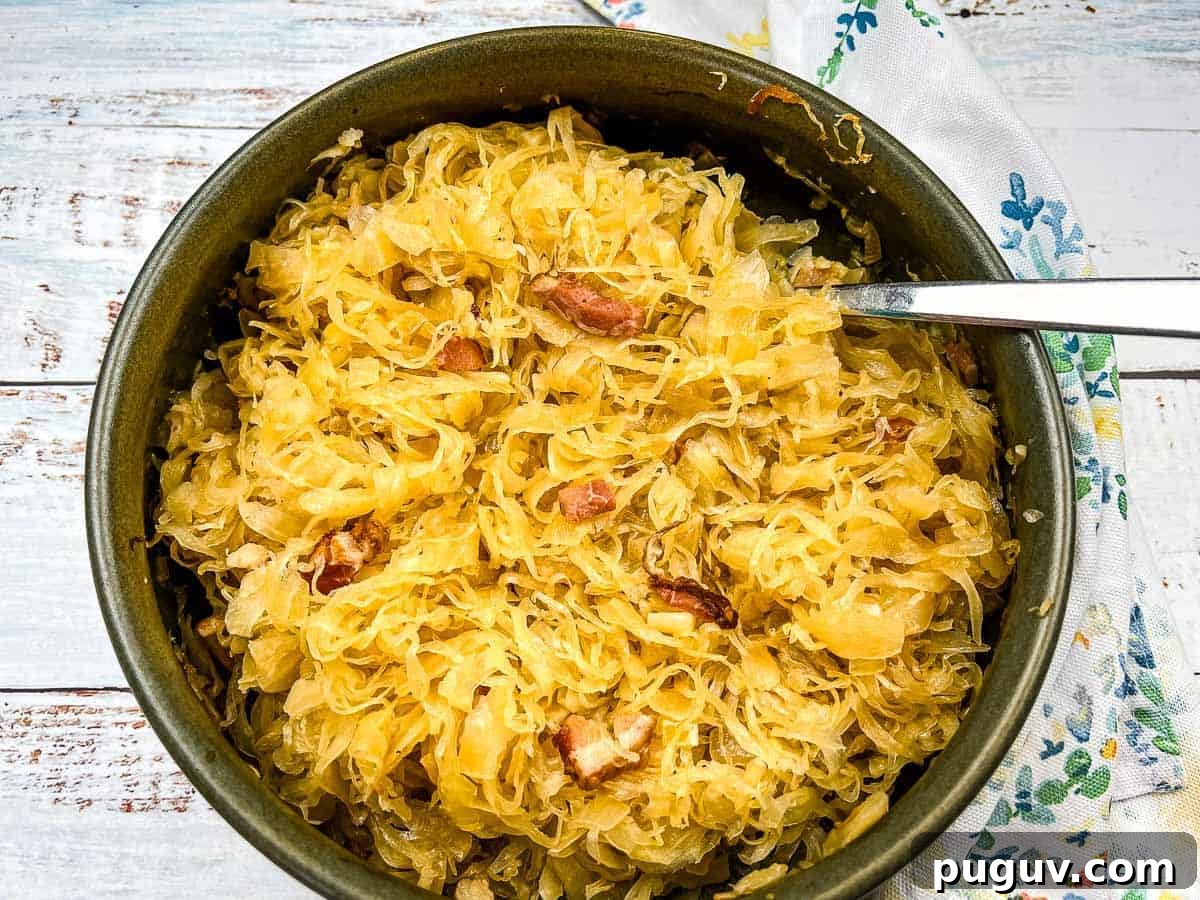 17 Low-Carb Meals That Keep You Full, Energized, and Ready 3 Sauerkraut in a serving dish with a spoon.