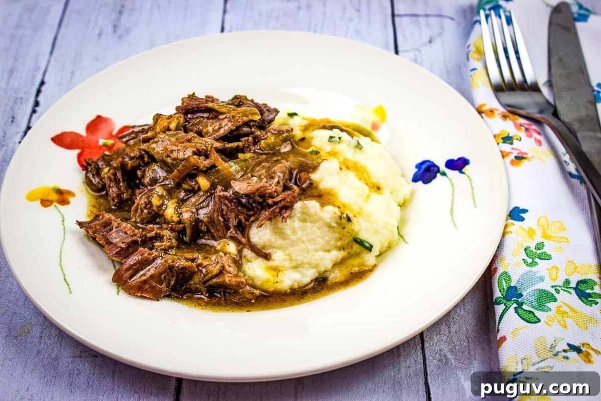17 Low-Carb Meals That Keep You Full, Energized, and Ready 7 A plate of pot roast with bacon and mashed potatoes with gravy.