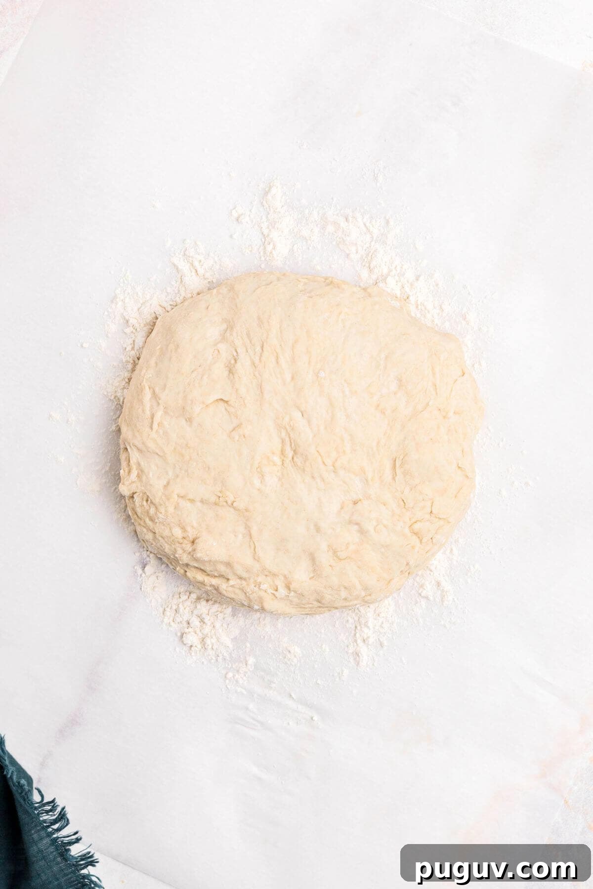 Crispy-On-The-Outside, Soft-On-The-Inside Air Fryer Pretzels 6 Pretzel dough kneaded and shaped into a round ball on a lightly floured surface.